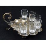 A Continental silver plated liqueur set, the Rococo cast stand housing six tot glasses.