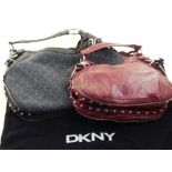 A DKNY ladies hobo handbag, monogram with black leather design,