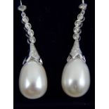 A pair of 18ct white gold, pearl and diamond drop earrings.