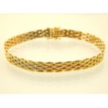 An Italian 18ct three colour yellow gold bracelet, with flat gate links, 15g. L. 20cm.