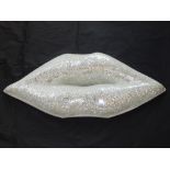 A contemporary sculpture, a pair of lips modelled with mirrored mosaic tiles, W. 80cm.