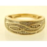 A 9ct yellow gold Cetic design gentleman's dress ring, set white stones.