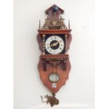 A 20th century Dutch bracket clock, the applied brass chapter ring with Roman numerals,