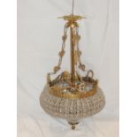 A gilt metal and clear glass bag shaped ceiling light, the body set octagonal beads. H.