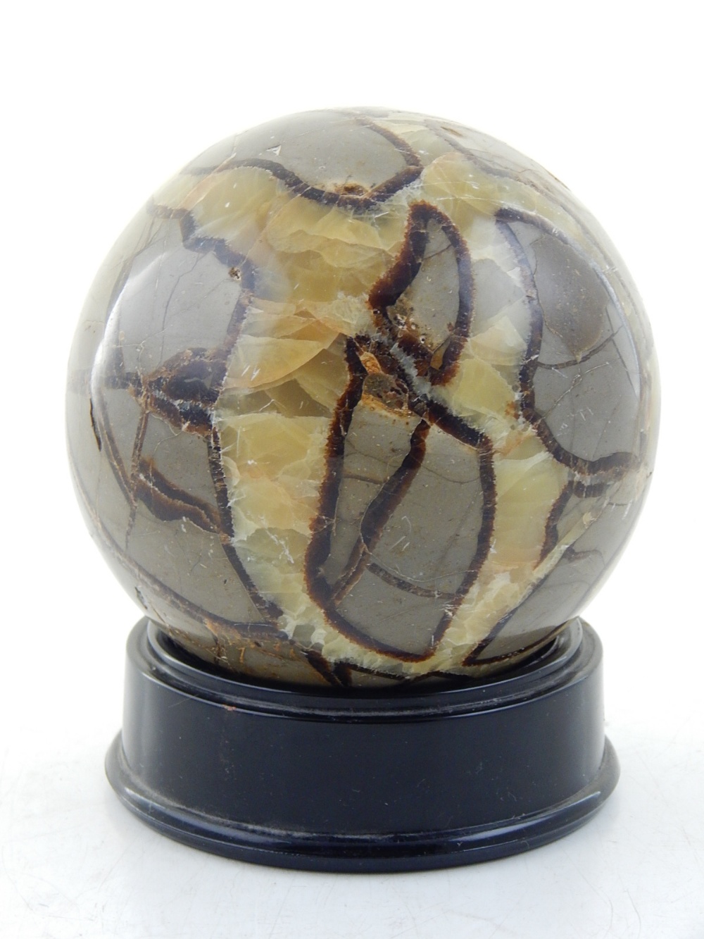 A marble paperweight, of globe form, D. 12cm.