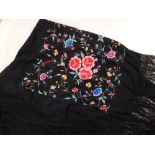 A Japanese embroided silk shawl, decorated with floral design.