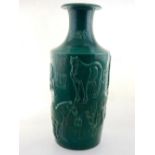 A Chinese green glazed porcelain vase, the body moulded with horses and script. H.