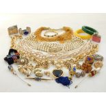 A quantity of costume jewellery including lighters.