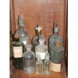 A large quantity of vintage scientific glassware to include flasks, stoppered jars, shaped and plain