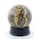 A marble paperweight of globe form, D. 12cm.