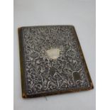 A Victorian silver mounted green leather blotter, Birmingham 1898, the cover embossed with scrolling