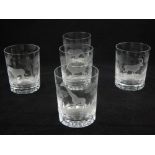 A set of five clear glass tumblers, probably retailed by Rowland Ward, etched with African scenes