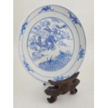 A Chinese blue and white porcelain saucer dish decorated with dragon and carp, bears six character