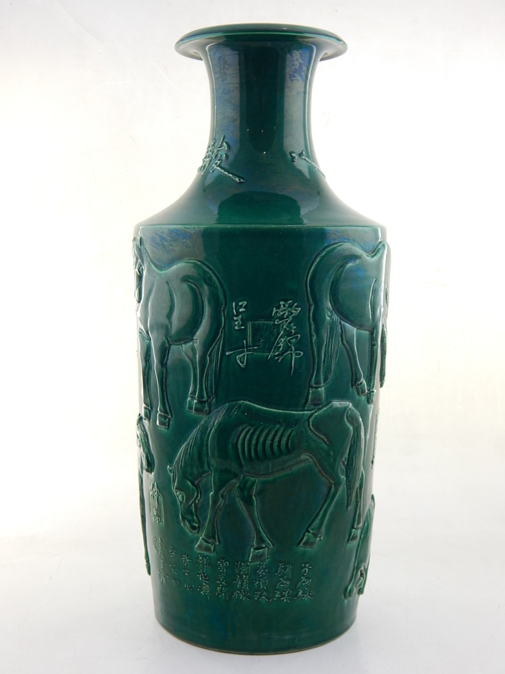 A Chinese green glazed porcelain vase, the body moulded with horses and script, H. 47cm. - Image 10 of 14