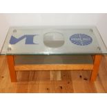 A Pan Am aluminium and maple rectangular two tier coffee table, the top printed with the airline