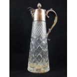 A silver mounted claret jug, London 1967, the spout in the form of a mask and engraved with foliage,