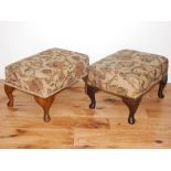 A pair of 20th century rectangular foot stools, covered on foliate fabric and on short cabriole