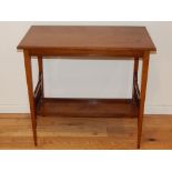 An Edwardian walnut occasional table, the rectangular top above an undertier with spindle supports