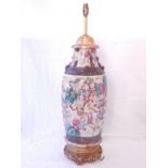 An early 20th century Chinese earthenware vase converted as a lamp, decorated with a continuous band