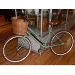 An Elswick Hopper ladies bicycle, circa 1965, fully refurbished and finished in a mint green livery,