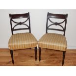 A pair of Regency mahogany dining chairs with X splats.