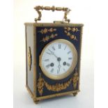 A late 19th century French gilt metal mounted ebonised mantel clock, the eight day movement striking