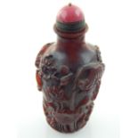A Chinese bottle shape scent bottle, floral carving and studies of frogs, pink jade stopper. H. 9.