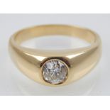 An 18ct yellow gold and single stone diamond ring, collet set central stone of approx. 1.25ct, large