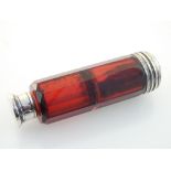 A mid Victorian silver mounted cranberry glass double ended scent bottle, one end incorporating a