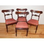 A set of six William IV rosewood dining chairs, with leaf capped rail backs above trafalgar seats,