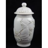 A Chinese blanc de chine jar and cover, the body relief decorated with the God of Longevity