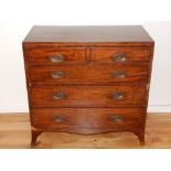 A George III mahogany chest of drawers, the rectangular top above an arrangement of two short and