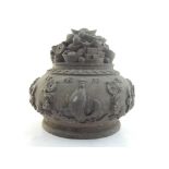 A Chinese bronze brush pot and cover, the lid modelled with depiction of old Chinese coins, the