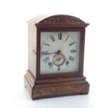 A late 19th century German Winterhalder and Hofmeier oak mantel clock, twin train movement, square