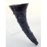 A Chinese resin horn libation cup, with pierced decoration depicting a forest. H. 29cm