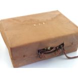 An early 20th century travelling vanity case, fitted interior with silver topped bottles, jars,