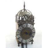 A 19th century brass lantern clock, in the 18th century style, chain driven thirty hour movement,