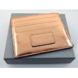 Alexander McQueen, copper finish leather wallet / card case, original packaging.