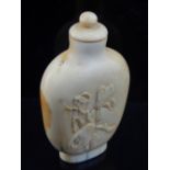 An early 20th century Chinese ivory snuff bottle, flower and branch carving. H. 7.5cm