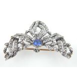 A Victorian yellow metal, diamond and sapphire brooch, set cushion cut central sapphire of approx.