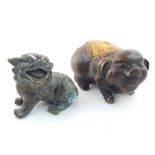 A Chinese bronze pig, gilt decorated with a fringed rug, L. 13cm, together with a Chinese bronze