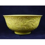 Chinese rice bowl, yellow glaze, dragons chasing the flaming pearl in relief, impress character