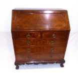 An early 20th century Georgian style mahogany bureau, the fall over two short and three graduated