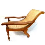 A Colonial Planter's chair with caned seat.