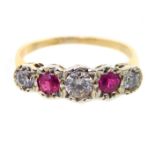 A yellow gold ruby and diamond graduated five stone ring, claw set.