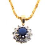 A 9ct yellow gold, diamond and sapphire cluster pendant, suspended on a 9ct rope twist chain.