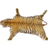 A taxidermy tiger skin wall hanging. L 180cm