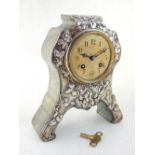 A French Art Nouveau white metal mounted shagreen mantel timepiece, eight-day drum movement, the