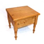 A Victorian pine commode on turned feet.