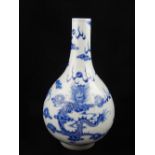 A Chinese bottle vase, blue and white glaze, decorated with dragons chasing a flaming pearl,